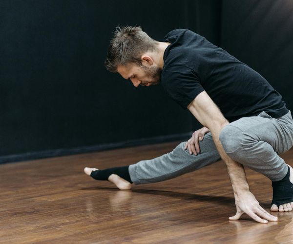 Man performing yoga exercises focusing on spine and joint mobility